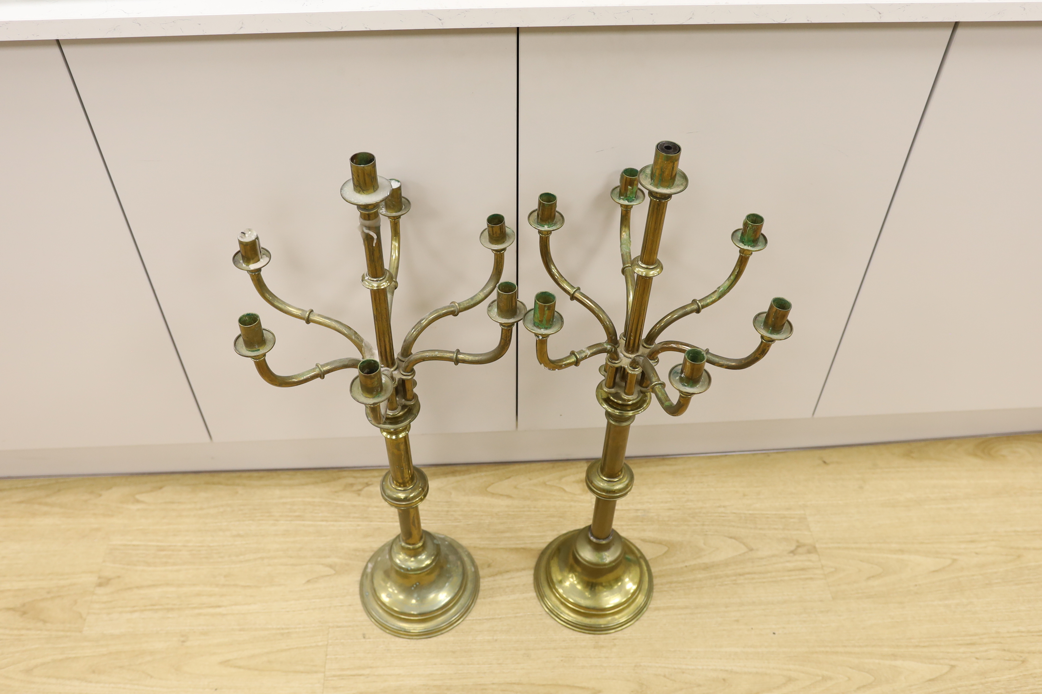 A pair of French brass altar six branch candelabra, 82cm high